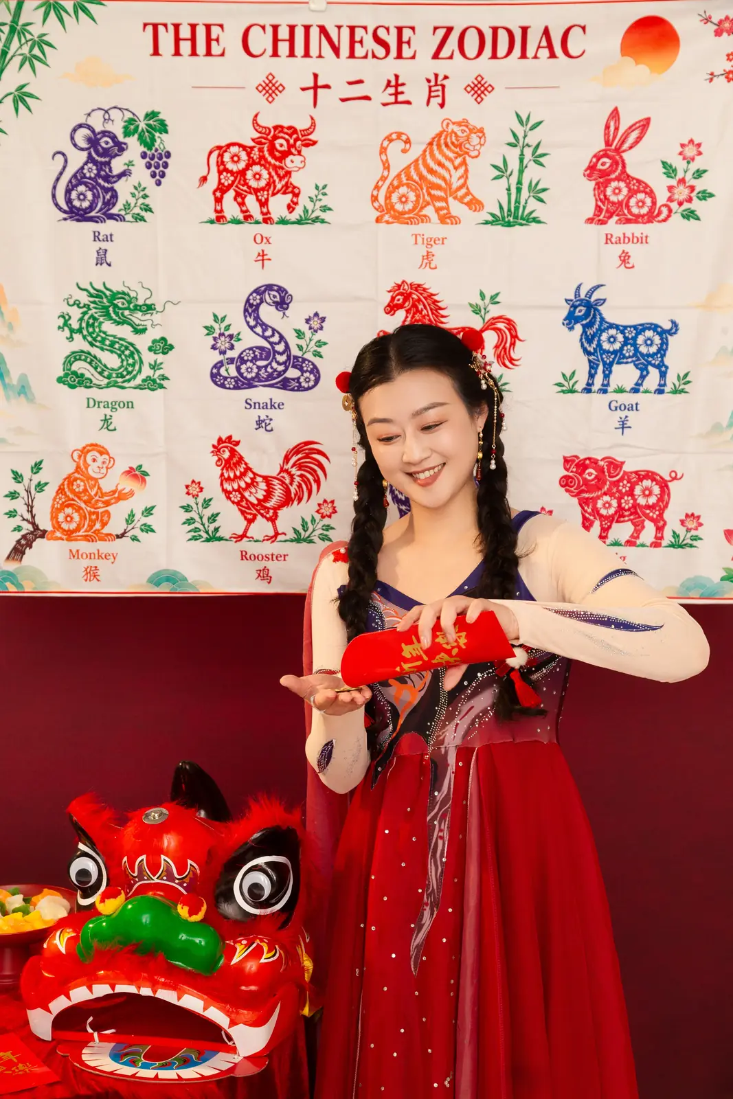 Raina with a lion dance head and festive treats