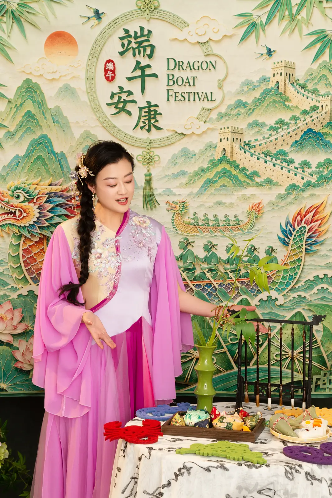 Raina in front of the Dragon Boat Festival backdrop