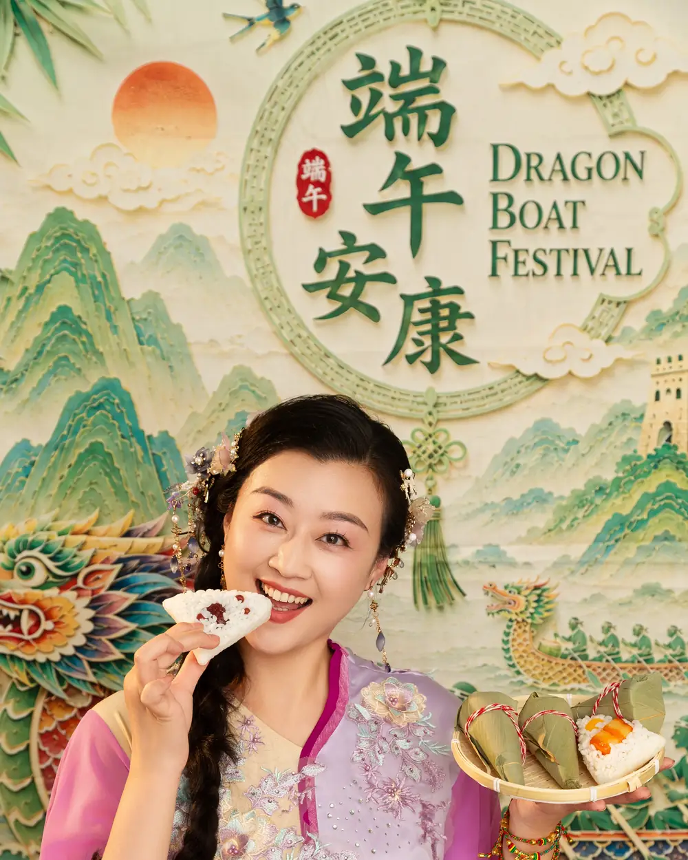 Raina tasting a zongzi rice dumpling, with a plate of zongzi